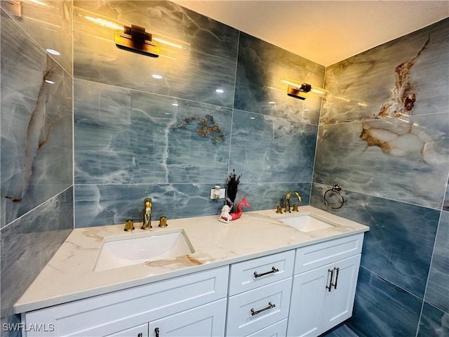 bathroom featuring tile walls and vanity