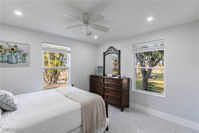 tiled bedroom with ceiling fan