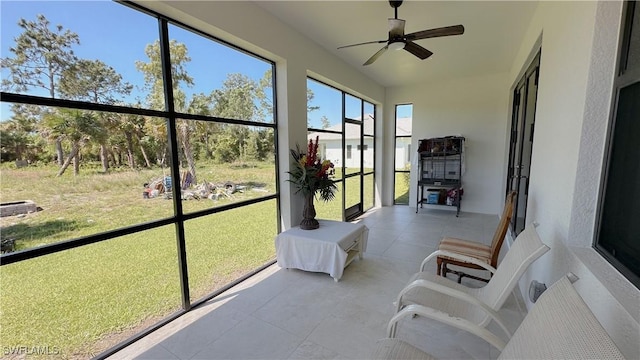 sunroom with a ceiling fan