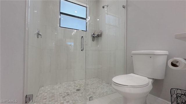 full bathroom with a shower stall and toilet