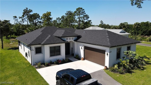 view of front of home with a garage, concrete driveway, a front lawn, and stucco siding