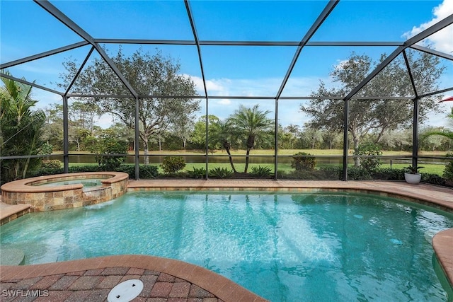 view of swimming pool featuring a lanai and a pool with connected hot tub