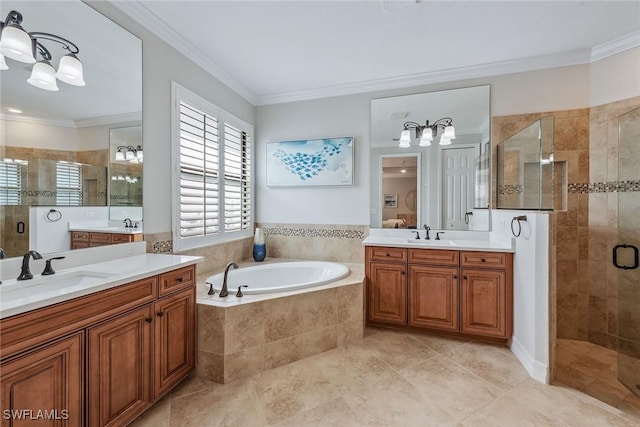 bathroom featuring ornamental molding, a garden tub, a sink, and a shower stall