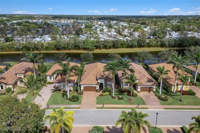 aerial view with a water view and a residential view