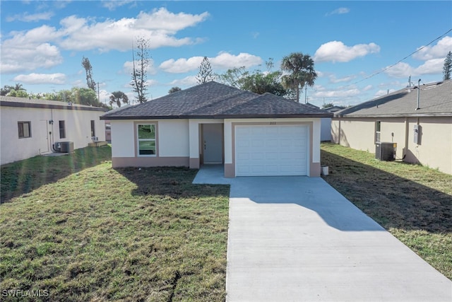 ranch-style home with driveway, an attached garage, central air condition unit, a front lawn, and stucco siding