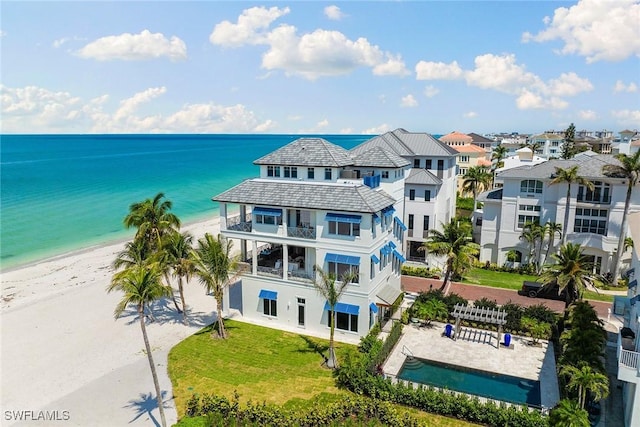 bird's eye view featuring a view of the beach and a water view