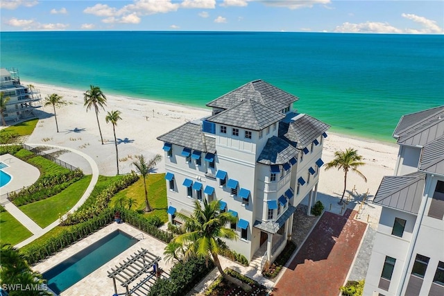 aerial view with a water view and a view of the beach