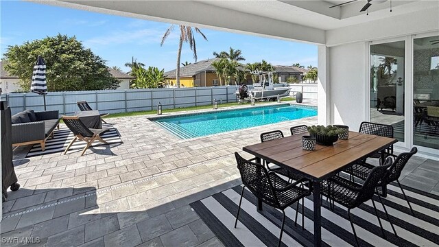 view of swimming pool featuring a fenced backyard, a fenced in pool, and a patio