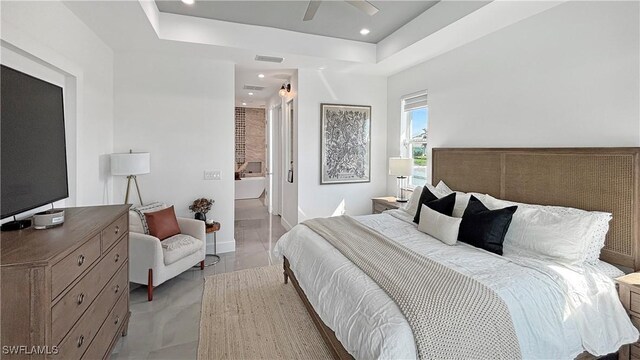 bedroom featuring recessed lighting, a raised ceiling, ceiling fan, and baseboards