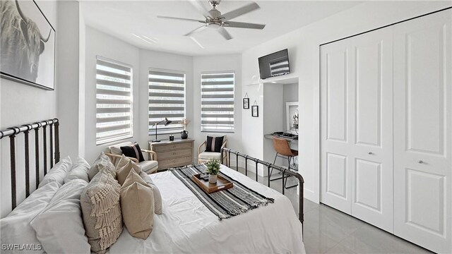 bedroom featuring light tile patterned floors and a ceiling fan