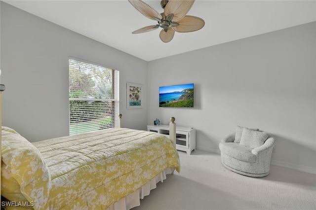 bedroom featuring carpet floors, baseboards, and a ceiling fan