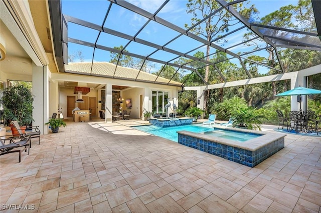 view of swimming pool featuring a patio area, a lanai, and a pool with connected hot tub