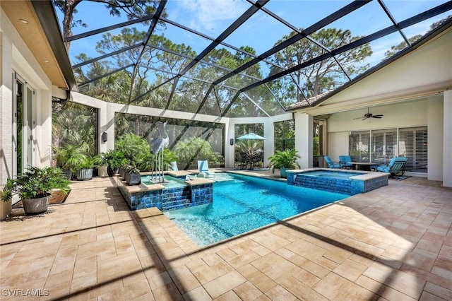 view of pool with a lanai, a patio area, ceiling fan, and a pool with connected hot tub