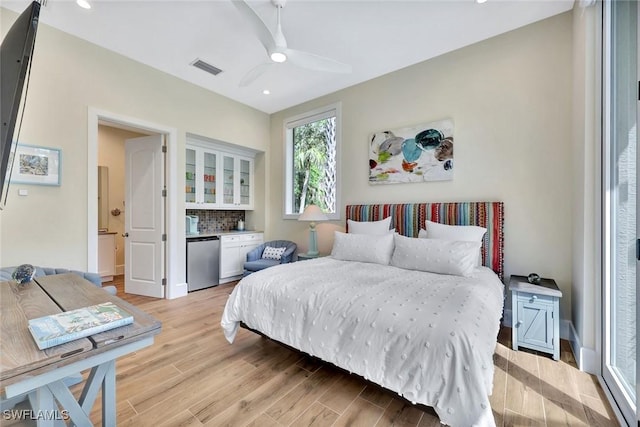 bedroom featuring recessed lighting, visible vents, light wood finished floors, and fridge