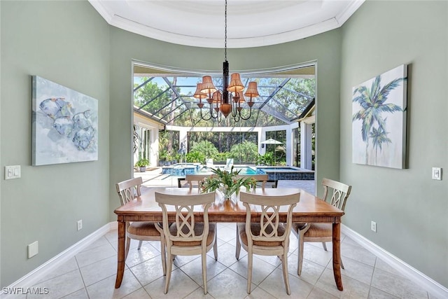 dining space featuring baseboards, plenty of natural light, and crown molding