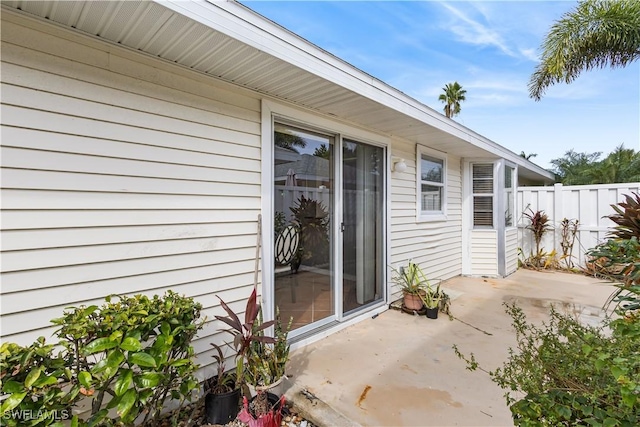 exterior space with a patio and fence