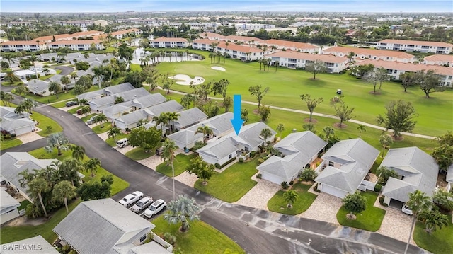 birds eye view of property with a residential view and golf course view