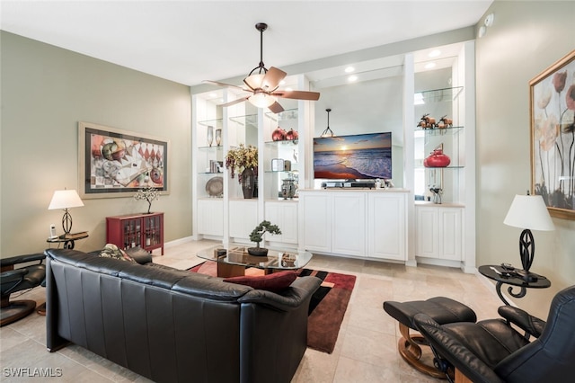 living room featuring light tile patterned floors, ceiling fan, built in features, and recessed lighting