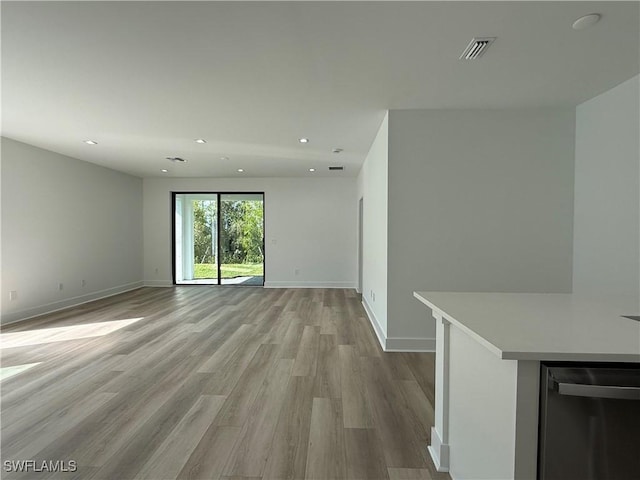 unfurnished living room with light hardwood / wood-style flooring