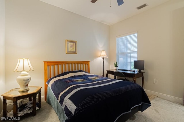 bedroom featuring ceiling fan and light colored carpet