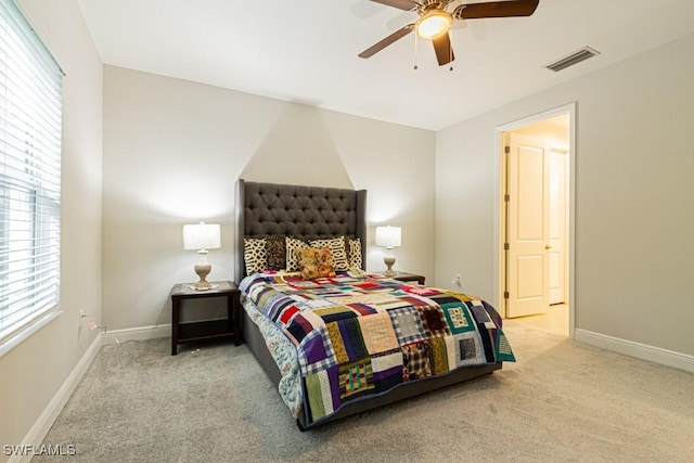 bedroom featuring light colored carpet and ceiling fan