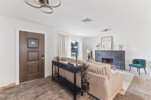 living area featuring a fireplace and visible vents