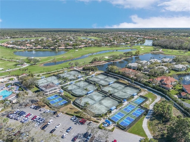 aerial view featuring view of golf course and a water view