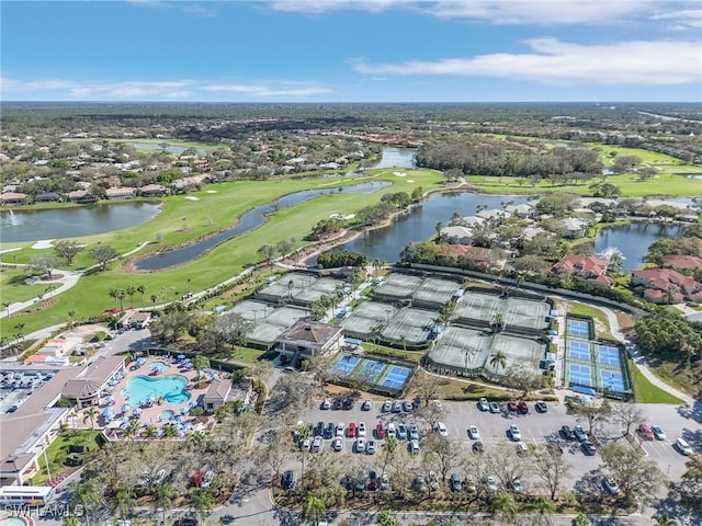 birds eye view of property featuring view of golf course and a water view