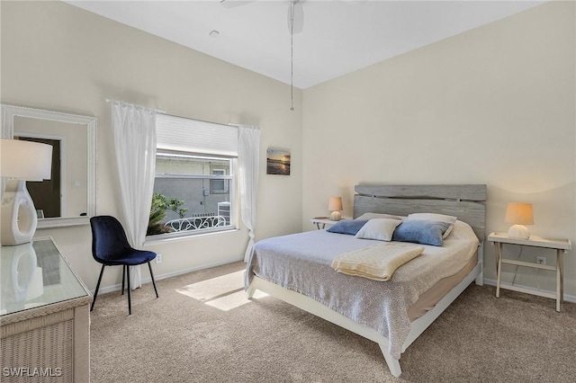 carpeted bedroom featuring baseboards