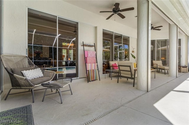 view of patio / terrace featuring ceiling fan