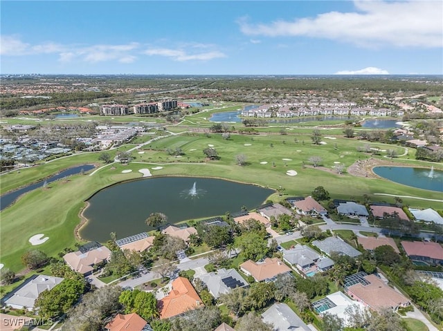 birds eye view of property featuring golf course view, a water view, and a residential view