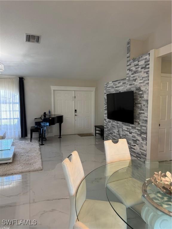 living room featuring vaulted ceiling