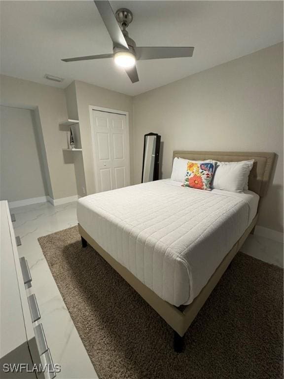 bedroom with a closet and ceiling fan