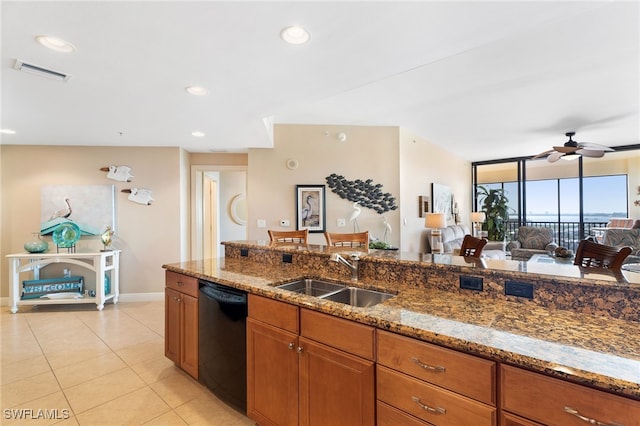 kitchen featuring brown cabinets, a sink, black dishwasher, visible vents, and ceiling fan