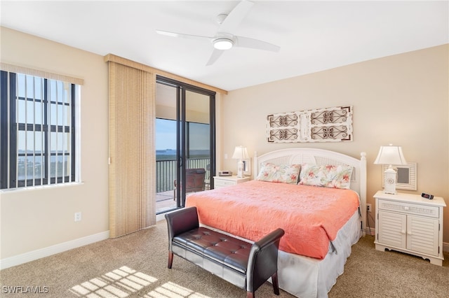 bedroom with access to exterior, carpet, multiple windows, and baseboards