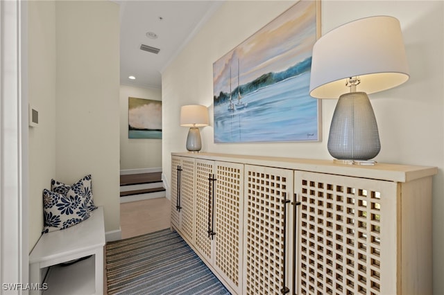 corridor featuring baseboards, visible vents, carpet, crown molding, and recessed lighting