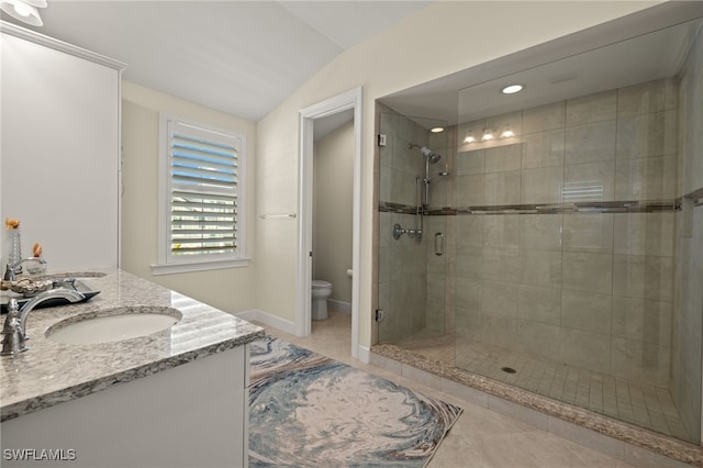 full bathroom featuring tile patterned flooring, toilet, a sink, vaulted ceiling, and a shower stall