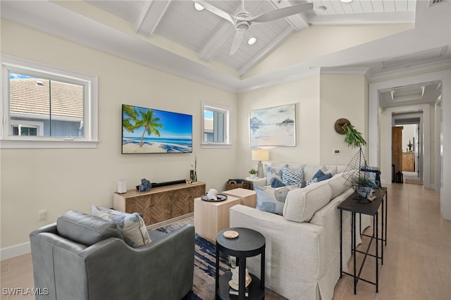 living area featuring vaulted ceiling with beams, wood finished floors, visible vents, a ceiling fan, and baseboards