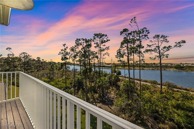 balcony at dusk with a water view