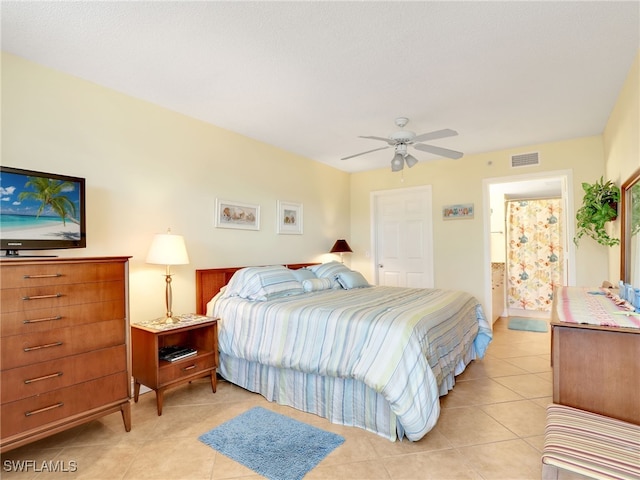 tiled bedroom with ceiling fan