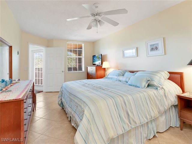 tiled bedroom with ceiling fan