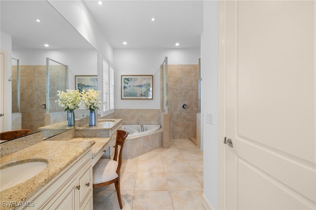 bathroom with recessed lighting, a walk in shower, vanity, a bath, and tile patterned floors