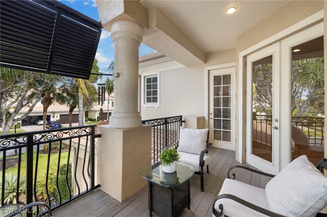 balcony featuring french doors
