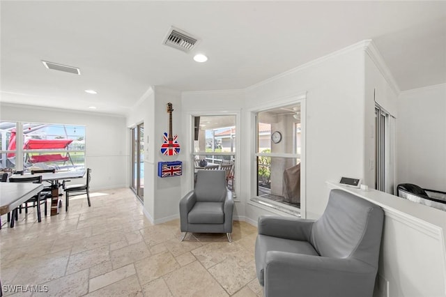 living area with crown molding, recessed lighting, baseboards, visible vents, and stone tile flooring