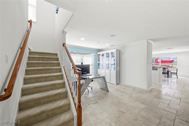 staircase featuring baseboards, recessed lighting, and stone tile flooring
