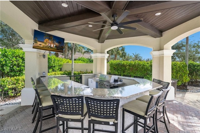 13789 Callisto Ave, Naples, FL 34109 - view of patio / terrace featuring an outdoor kitchen and a ceiling fan