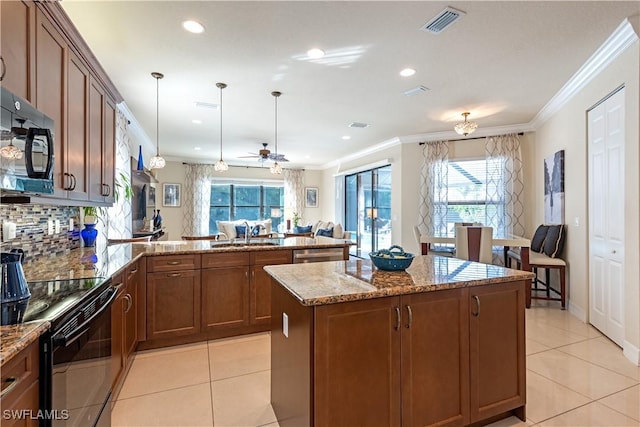 13789 Callisto Ave, Naples, FL 34109 - kitchen with black appliances, light tile patterned floors, a peninsula, crown molding, and light stone counters