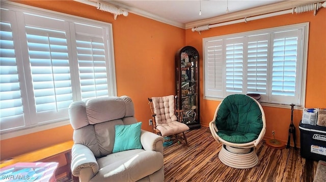 sitting room featuring crown molding