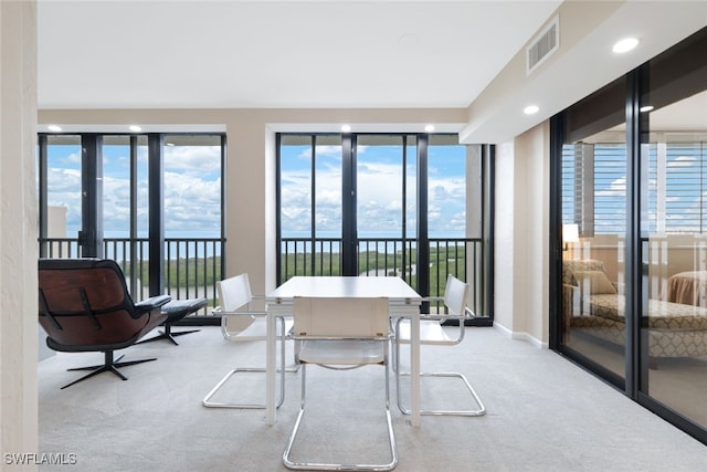 sunroom with a wealth of natural light and visible vents