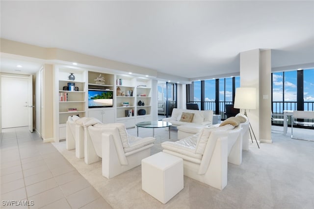 living area with light tile patterned flooring and light carpet